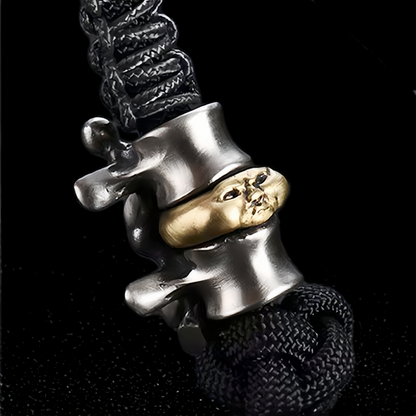 Disc Goblin – Anatomical Spine Knife Bead | Bronze and White Brass EDC Paracord Bead with Grinning Disc Face