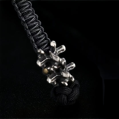 Disc Goblin – Anatomical Spine Knife Bead | Bronze and White Brass EDC Paracord Bead with Grinning Disc Face