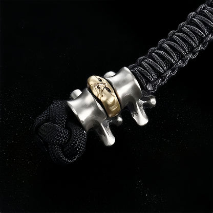 Disc Goblin – Anatomical Spine Knife Bead | Bronze and White Brass EDC Paracord Bead with Grinning Disc Face