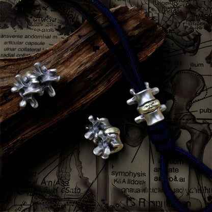 Disc Goblin – Anatomical Spine Knife Bead | Bronze and White Brass EDC Paracord Bead with Grinning Disc Face