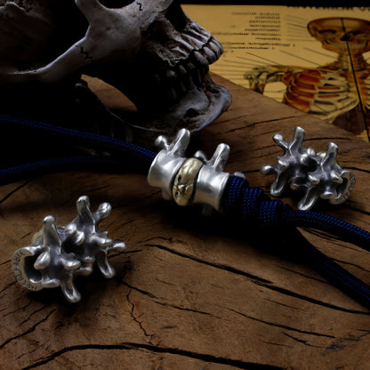 Disc Goblin – Anatomical Spine Knife Bead | Bronze and White Brass EDC Paracord Bead with Grinning Disc Face